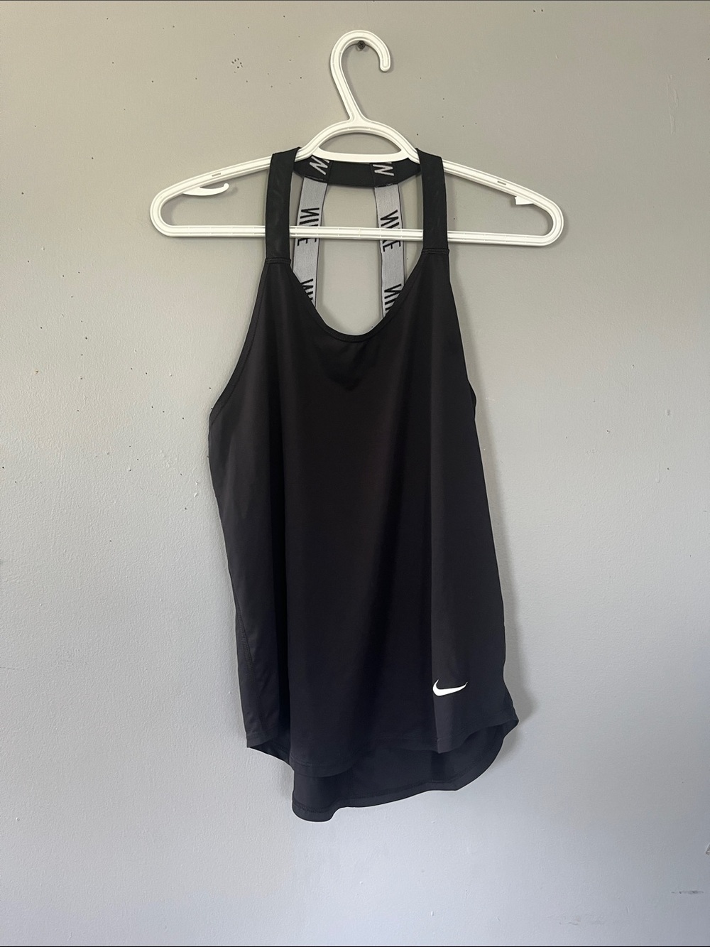 Woman’s Nike Black Racerback Performance Tank with White Swoosh Small